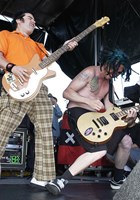 Fat Mike, Eric Melvin of NOFX on stage for Vans Warped Tour Concert - Seaside Park, Seaside Park, Ventura, CA, July 07, 2004. Photo by: Jared Milgrim/Everett Collection