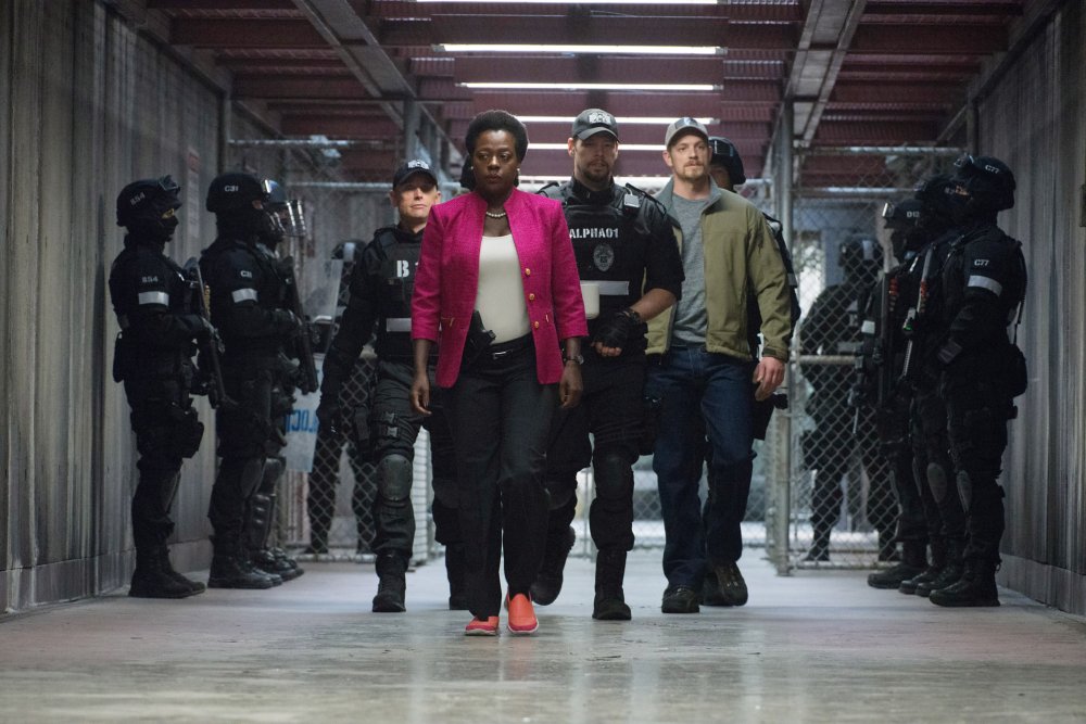 SUICIDE SQUAD, Viola Davis (front), Ike Barinholtz (center), Joel Kinnaman (green jacket), 2016. ph: Clay Enos/© Warner Bros.