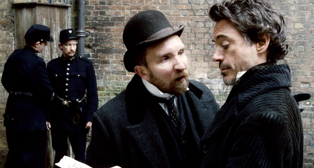 SHERLOCK HOLMES, front, from left: Eddie Marsan, Robert Downey Jr., 2009. ©Warner Bros.