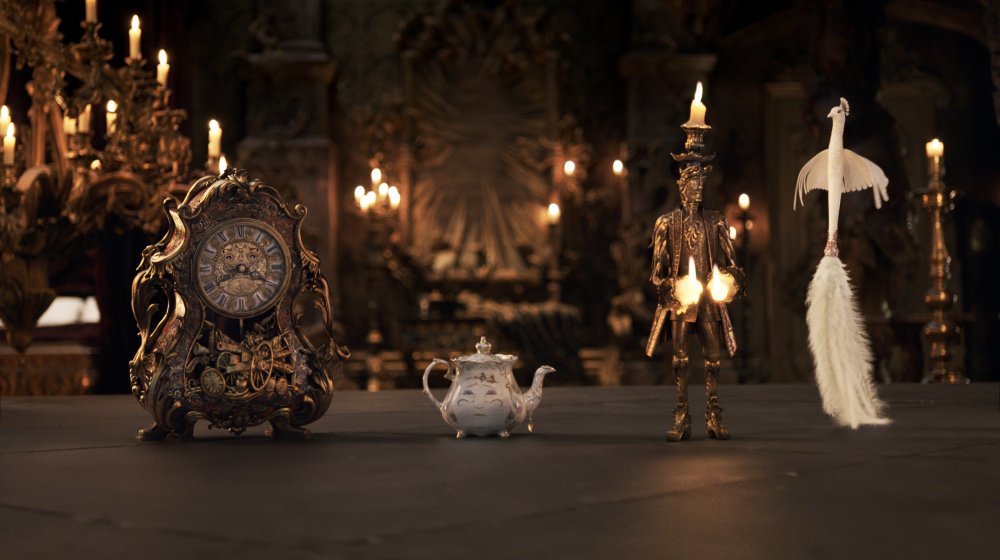 BEAUTY AND THE BEAST, FROM LEFT: COGSWORTH (VOICE: IAN MCKELLEN), MRS. POTTS (VOICE: EMMA THOMPSON), LUMIERE (VOICE: EWAN MCGREGOR), PLUMETTE (VOICE: GUGU MBATHA-RAW), 2017. © WALT DISNEY PICTURES