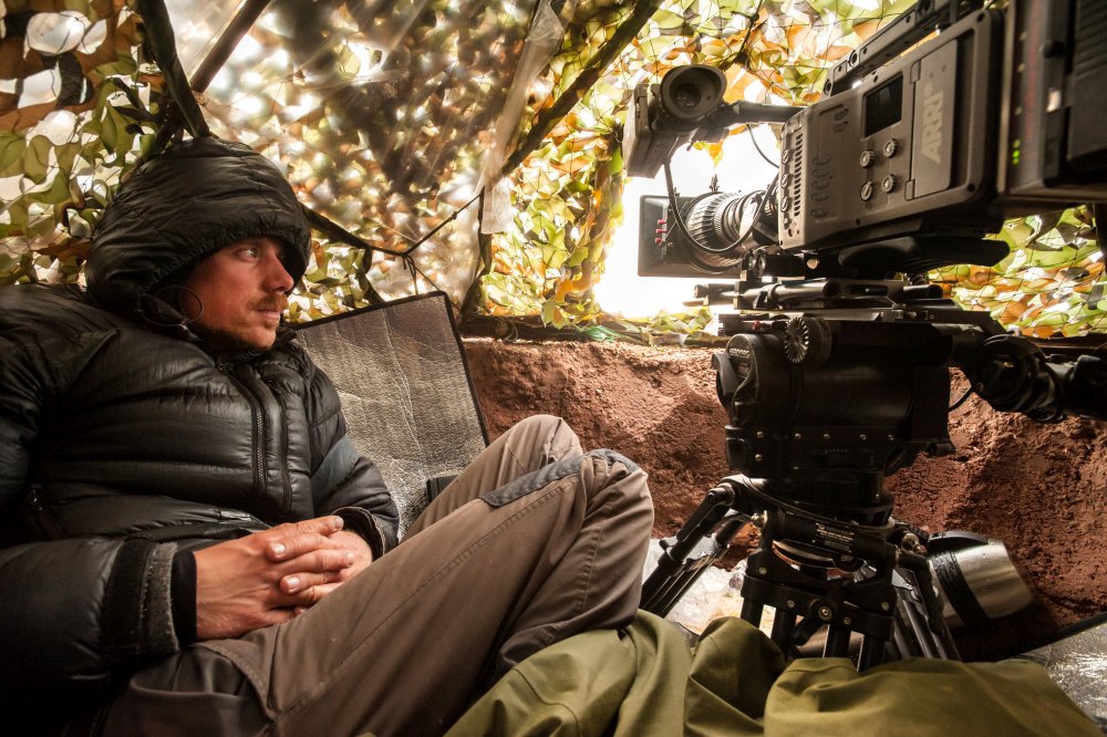 Description: Cinematographer Rolf Steinmann waits in a hide to film chiru.
