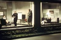 PLAYTIME, Jacques Tati (standing, third from left, in raincoat), 1967