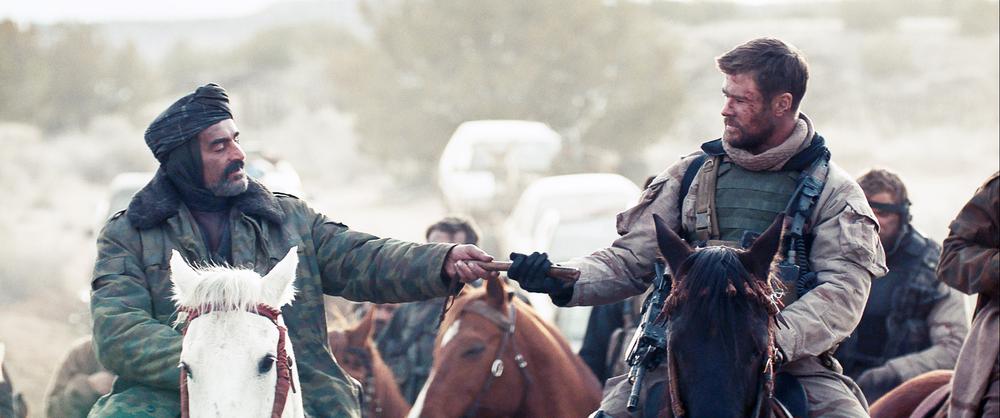 12 STRONG, FROM LEFT: NAVID NEGAHBAN, CHRIS HEMSWORTH, 2018. © WARNER BROS. PICTURES