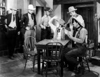 ARIZONA DAYS, Tex Ritter (center, standing), Glenn Strange (far right, sitting), 1937