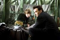 2012, Liam James (back left), John Cusack (right), 2009. ©Sony Pictures