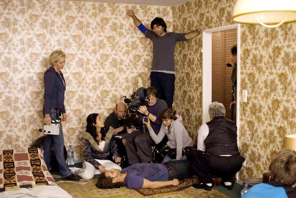 SOUL KITCHEN, Dorka Gryllus (seated far left), Adam Bousdoukos (on floor), director Fatih Akin (top), on set, 2009. ©Pandora