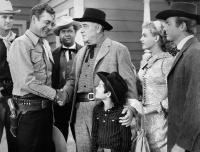 WHIRLWIND RAIDERS, second, fourth, fifth and sixth from left: Charles Starrett, Philip Morris, Don Reynolds, Nancy Saunders, 1948