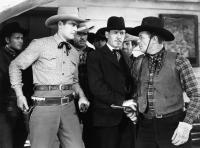 TWO-FISTED RANGERS, front from left: Charles Starrett, Kenneth MacDonald, Dick Curtis, 1939