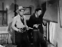 GUN PACKER, from left: Jack Randall, Glenn Strange, 1938