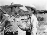 CHALLENGE OF THE RANGE, from left, Charles Starrett, Billy Halop, 1949