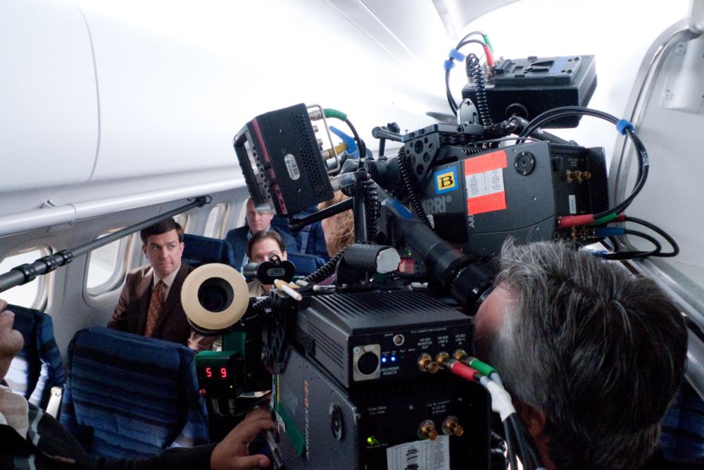 CEDAR RAPIDS, Ed Helms (left), on set, 2011. ph: Zade Rosenthal/TM and Copyright ©Fox Searchlight Pictures. All rights reserved.