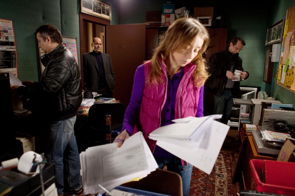 THE NIGHT CLERK, (aka AVANT LAUBE), Jean-Pierre Bacri (in doorway), Sylvie Testud (front), 2011. ph: Ricardo Vaz Palma/©TF1 International