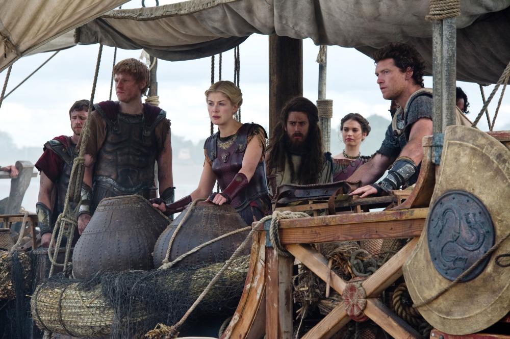 WRATH OF THE TITANS, Rosamund Pike (center), Toby Kebbell (long hair), Lily James (back right), Sam Worthington (right), 2012. ph: Jay Maidment/©Warner Bros. Pictures.