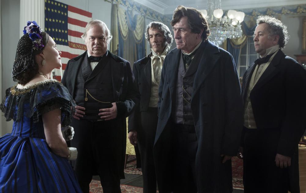 LINCOLN, Sally Field (blue dress), Tommy Lee Jones (second from right), David Costabile (right), 2012, ph: David James/TM and Copyright ©20th Century Fox Film Corp. All rights reserved.