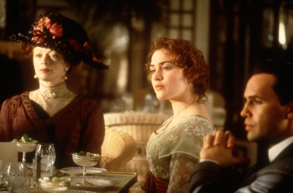 TITANIC, Frances Fisher, Kate Winslet, Billy Zane, 1997, table. TM and Copyright (c) 20th Century Fox Film Corp. All rights reserved..