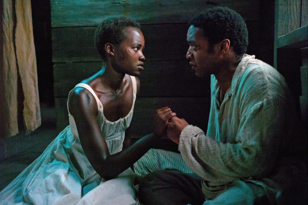 12 YEARS A SLAVE, l-r: Lupita Nyong'o, Chiwetel Ejiofor, 2013, ph: Francois Duhamel/TM and Copyright ©Fox Searchlight Pictures. All rights reserved.