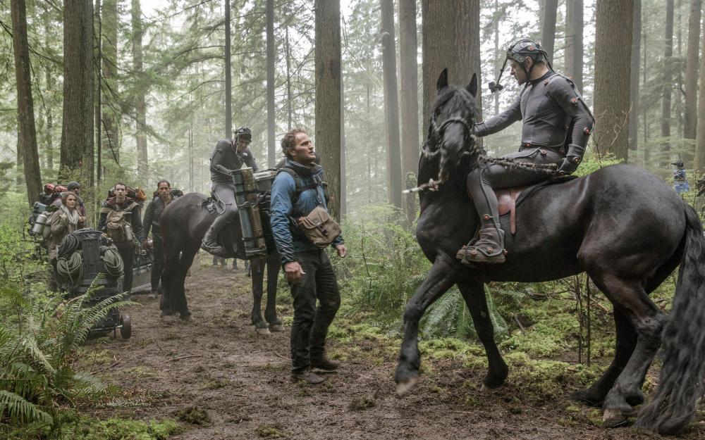 DAWN OF THE PLANET OF THE APES, Jason Clarke (center), Andy Serkis (right), 2014. ph: David James/TM and ©Copyright Twentieth Century Fox Film Corporation. All rights reserved.