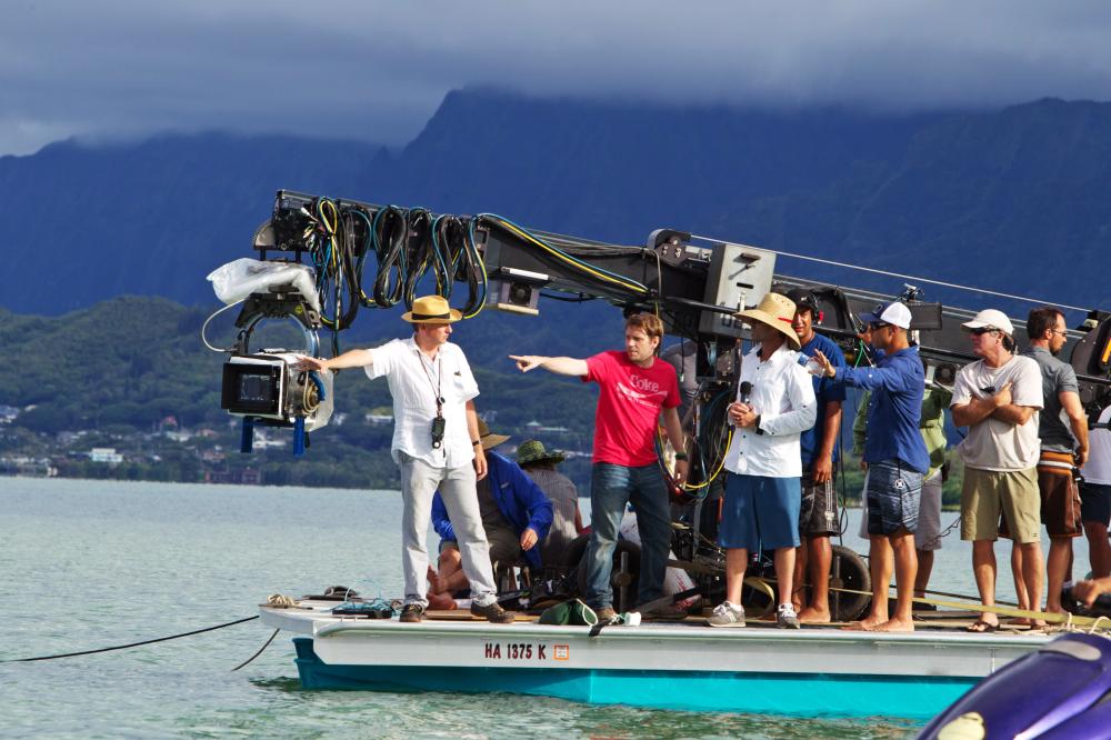 GODZILLA, cinematographer Seamus McGarvey (left), director Gareth Edwards (pointing), on set, 2014. ph: Phil Bray/©Warner Bross. Pictures