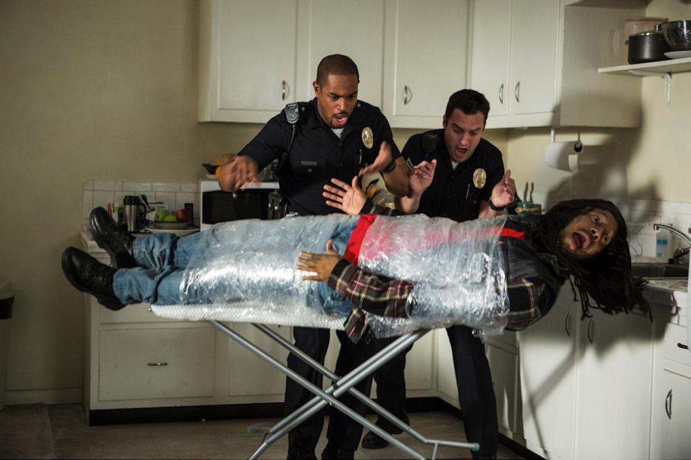 LET'S BE COPS Phony cops Justin (Damon Wayans Jr.) and Ryan (Jake Johnson) react to the predicament of their new "colleague" Pupa (Keegan-Michael Key). Ph: Frank Masi, SMPSP TM and © 2014 Twentieth Century Fox Film Corporation. All Rights Reserved. No
