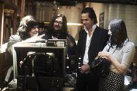 20,000 DAYS ON EARTH, from left: directors Jane Pollard, and Iain Forsyth, Nick Cave, Susie Bick, 2014. ©Drafthouse Films